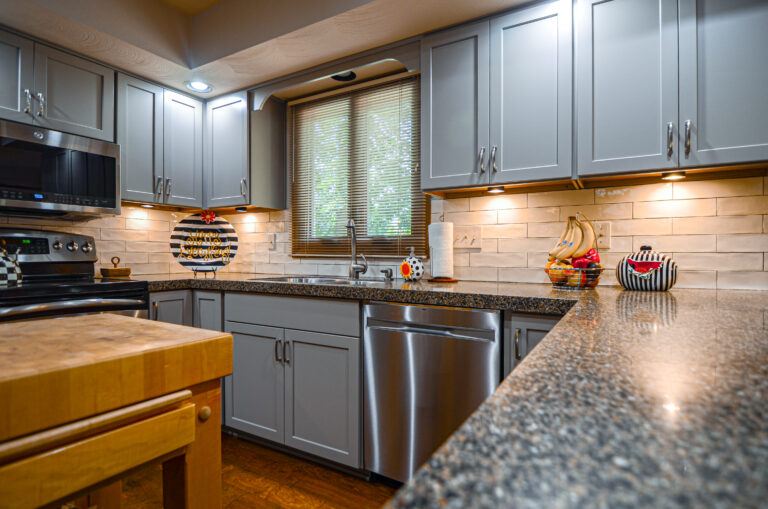 Bright remodeled kitchen with an island and pendant lighting
