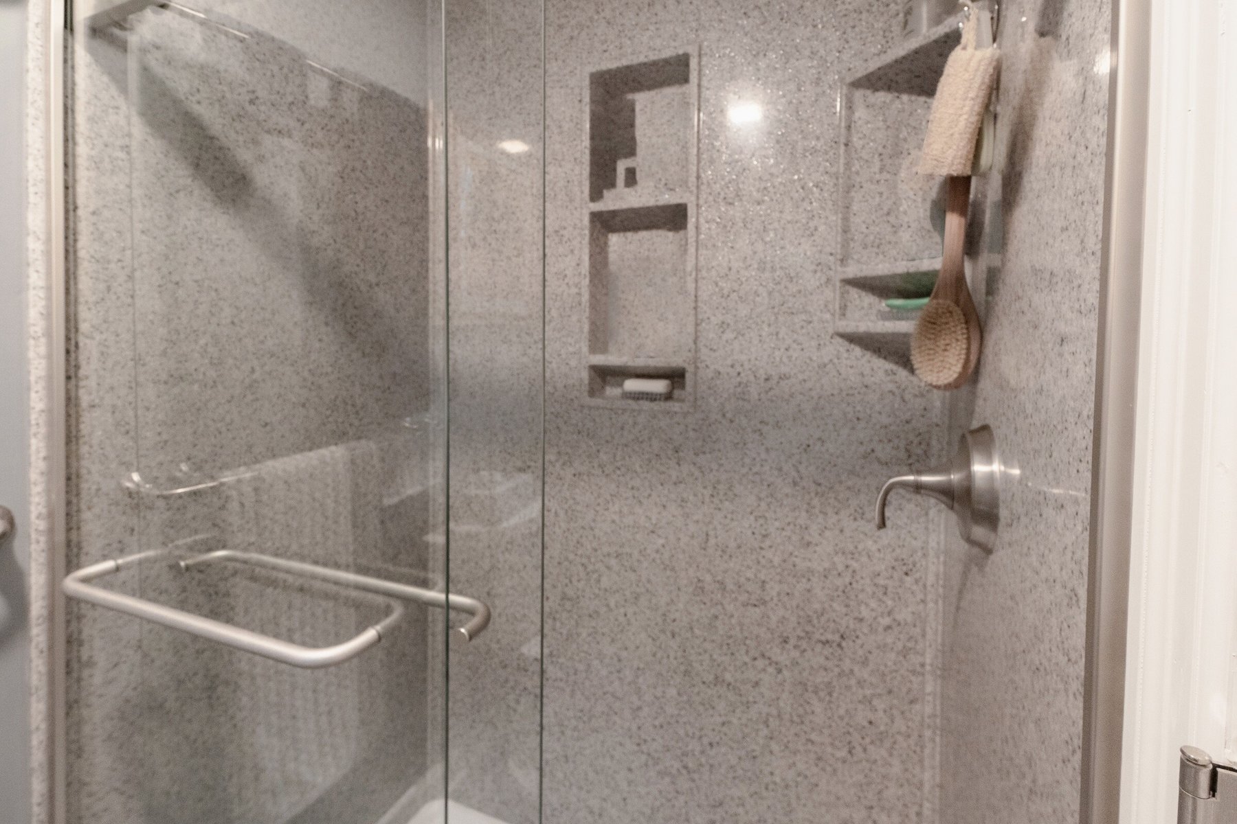Remodeled full bathroom with a walk-in shower and new vanity