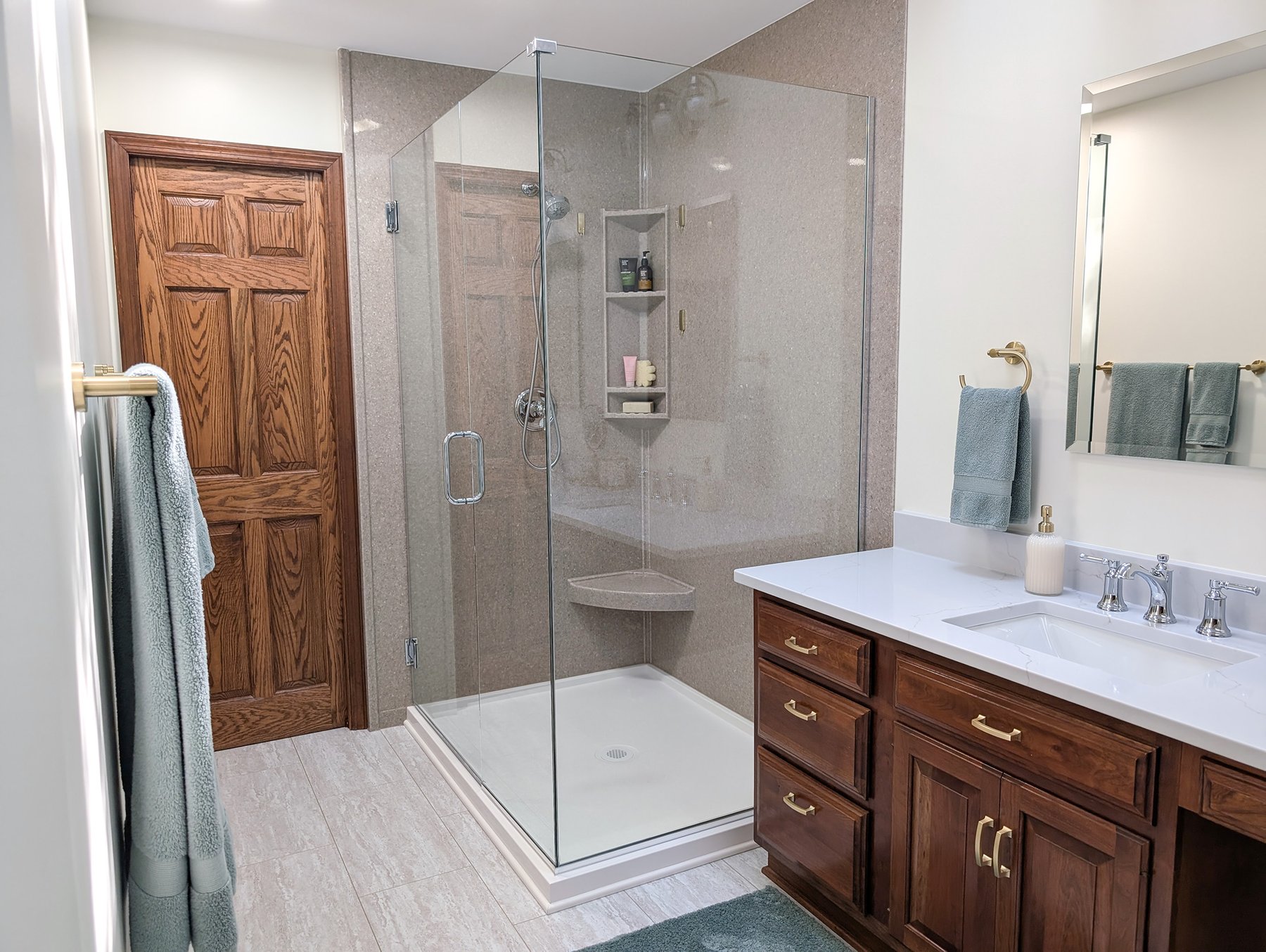 Owners suite bathroom with a glass shower enclosure and double vanity