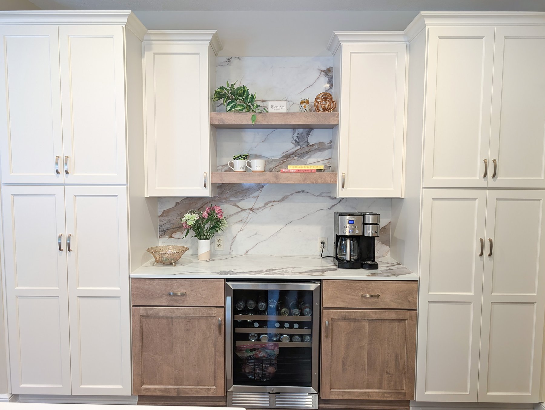 Remodeled kitchen with grey shaker cabinetry, tile backsplash and stainless appliances
